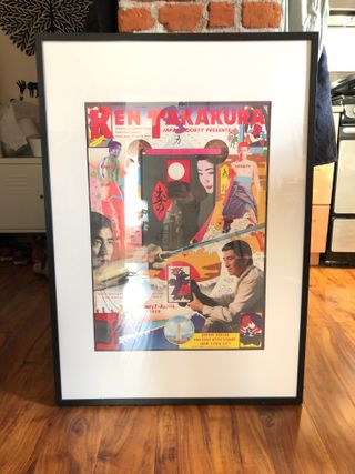 A framed print depicting stills of actor Ken Takakura from four films.