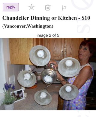 A woman holding a chandelier looks surprised as the camera flashes in a Craiglist ad entitled ‘Chandelier Dinning or Kitchen‘.